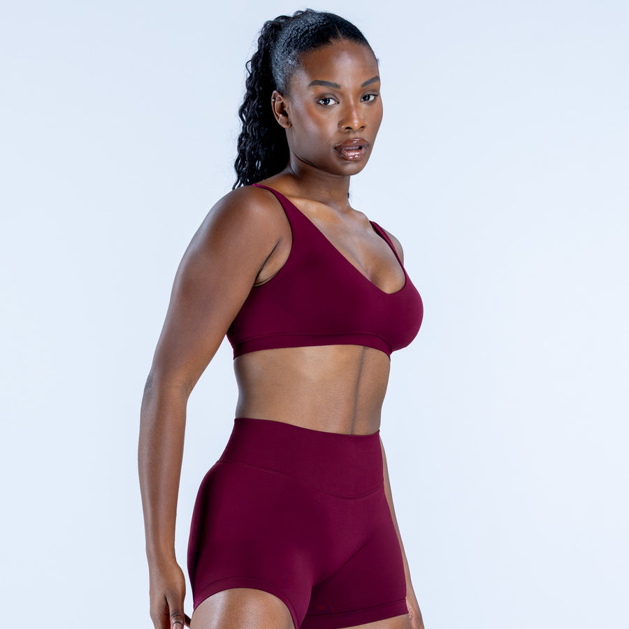 Scoop-neck sports bra in deep burgundy, wide straps