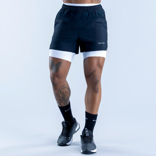 Black compression base-layer shorts with white hem band and elastic waistband