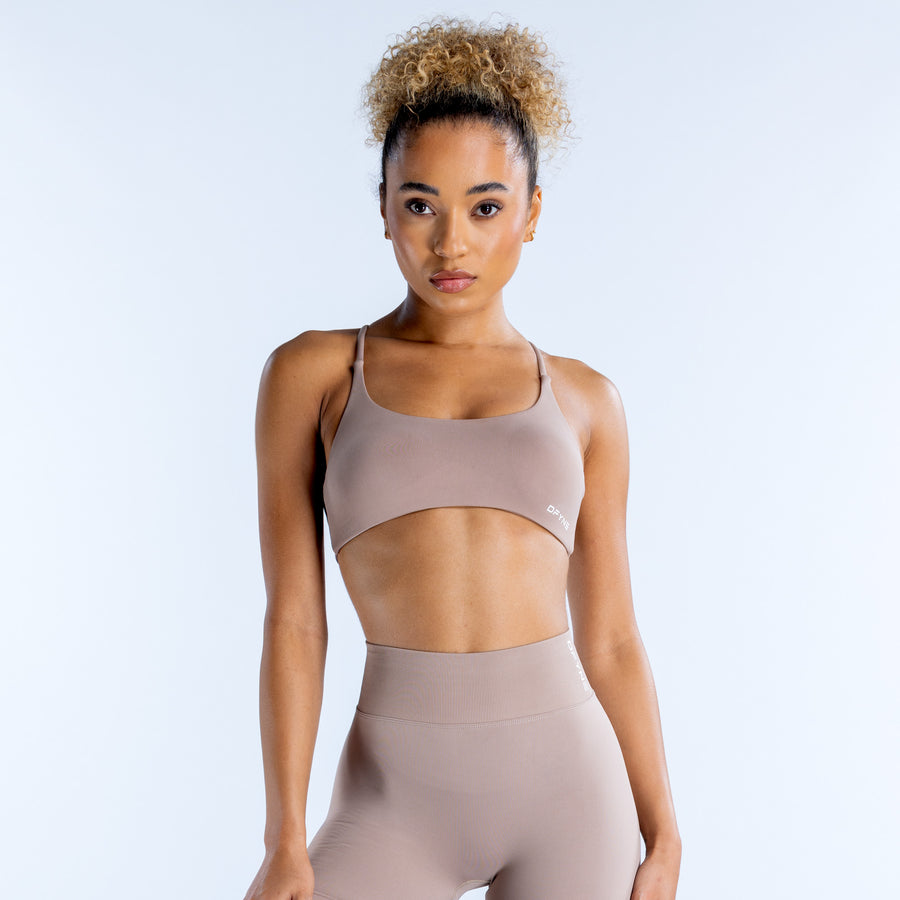 Mauve scoop-neck sports bra with racerback and smooth stretch fabric