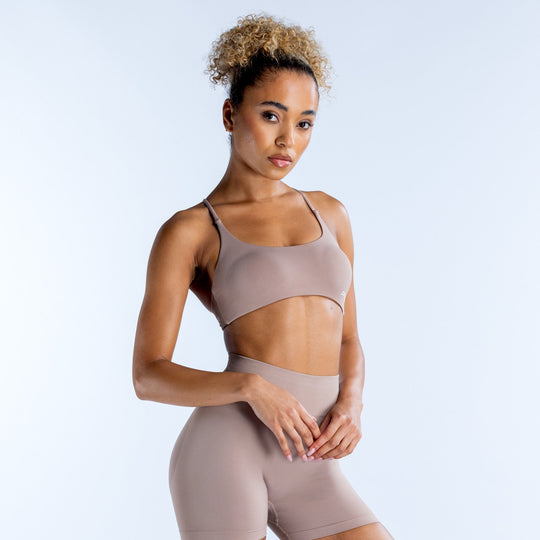 Taupe strappy sports bra with scoop front and smooth stretch fabric