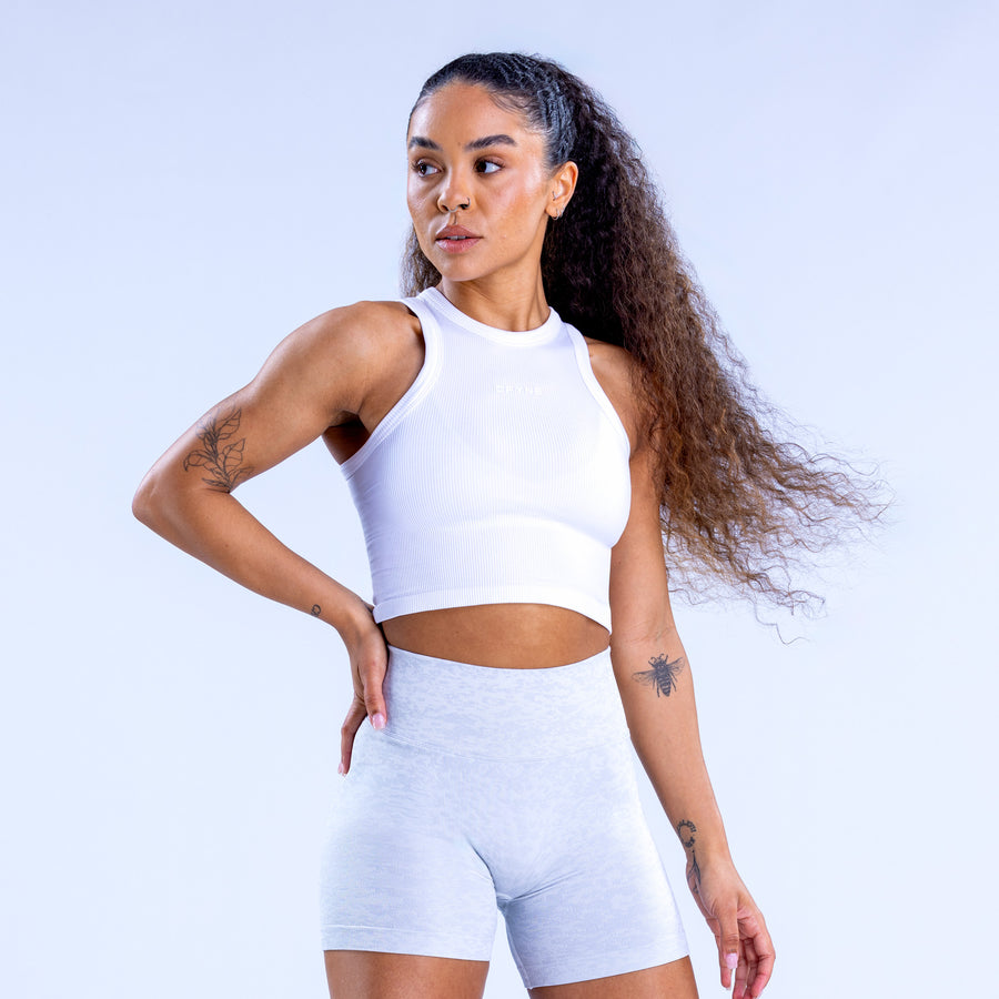 White racerback crop top with sleeveless high neck and fitted waist
