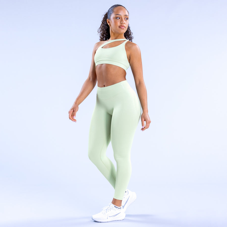 Light-mint asymmetric sports bra with front cutout and scoop neckline