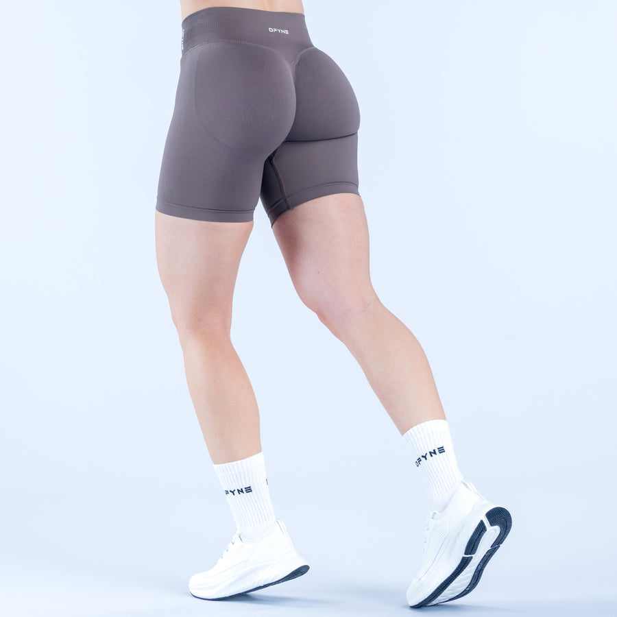 Back view of 6.5 in impact biker shorts, dark gray, sculpted seams