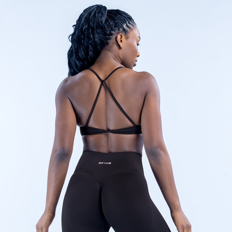 Black twist-back sports bra back view with crisscross straps