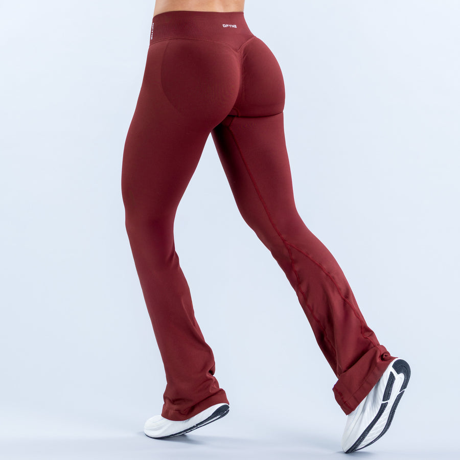 Burgundy flared leggings with a high waistband and fitted back