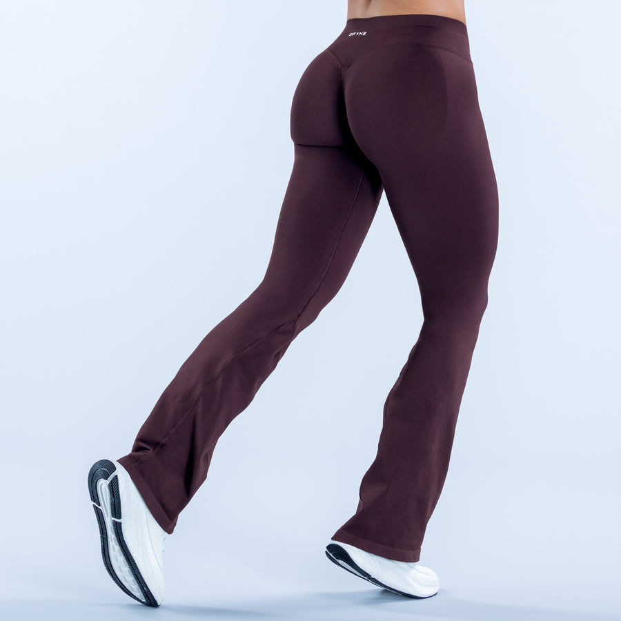 Burgundy flare leggings, back view with wide bell legs and flared cuffs
