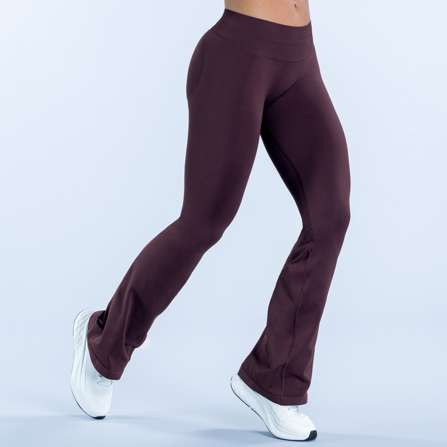 Burgundy flare leggings, front view with flared cuffs and smooth stretch fabric