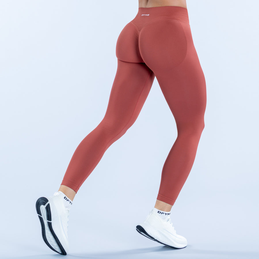 Terracotta impact leggings with sculpted rear panel and ankle-length slim fit
