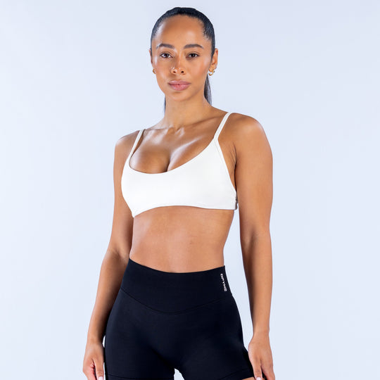 White scoop-neck sports bra with thin straps