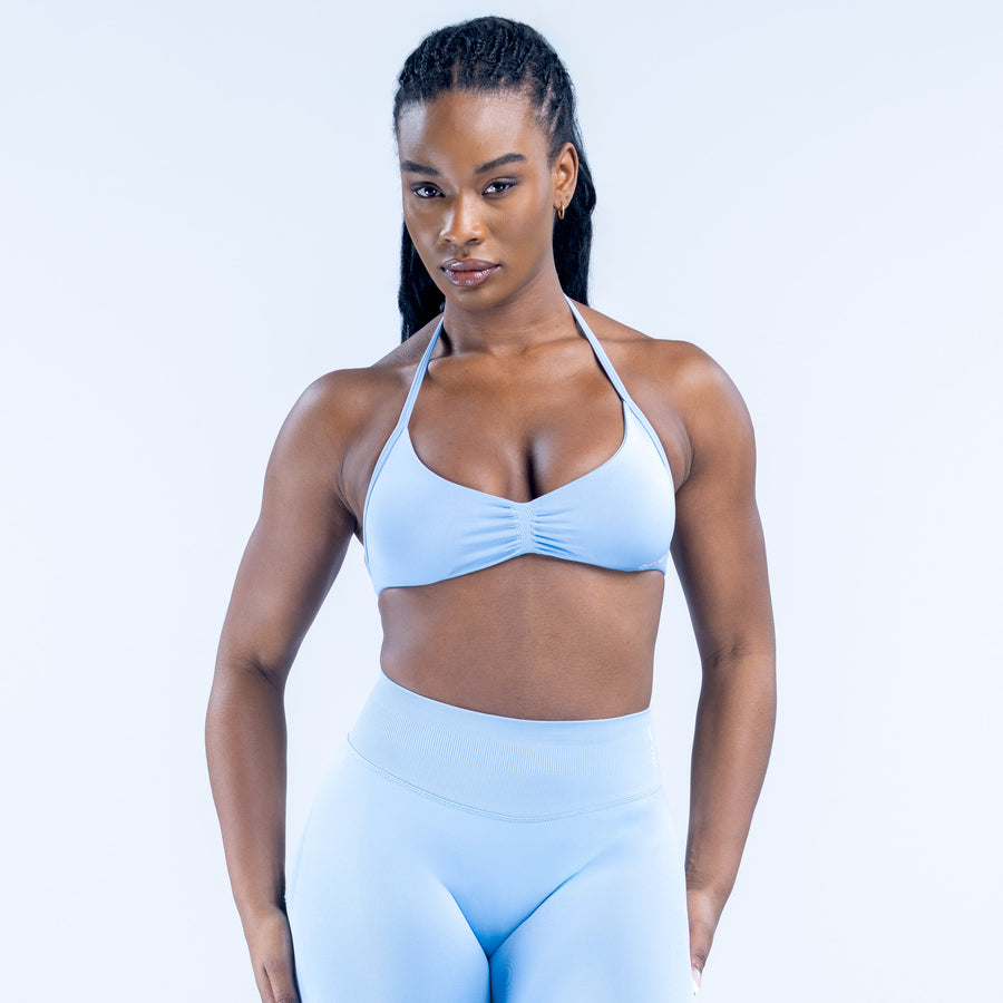 Light blue strappy bra with ruched center and thin adjustable straps