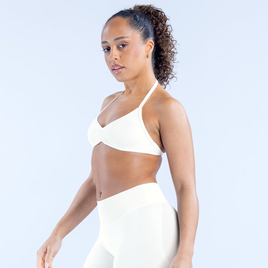 White strappy bra with thin shoulder straps and V neckline, side view