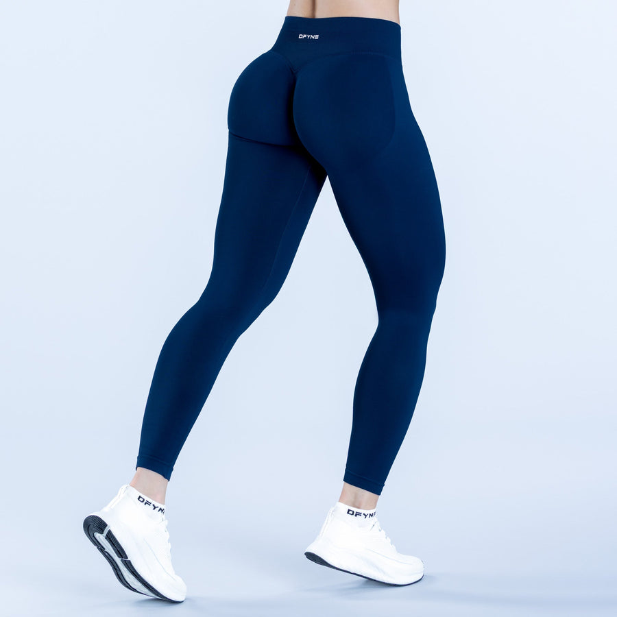 Dark navy impact leggings with high-rise waistband and full-length legs, rear view.