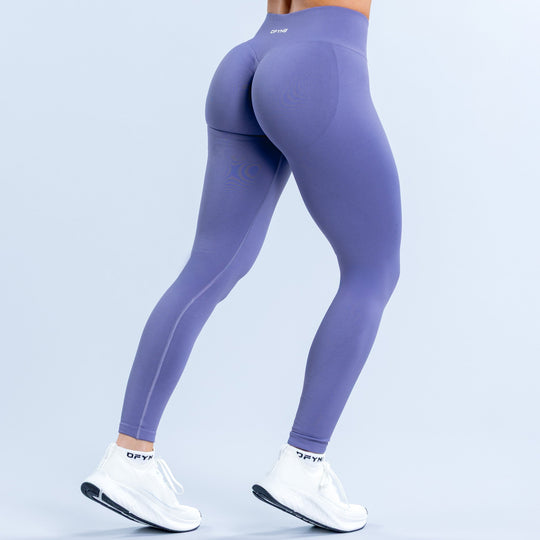 Purple high-waist leggings, back seam detailing and small logo near waistband.