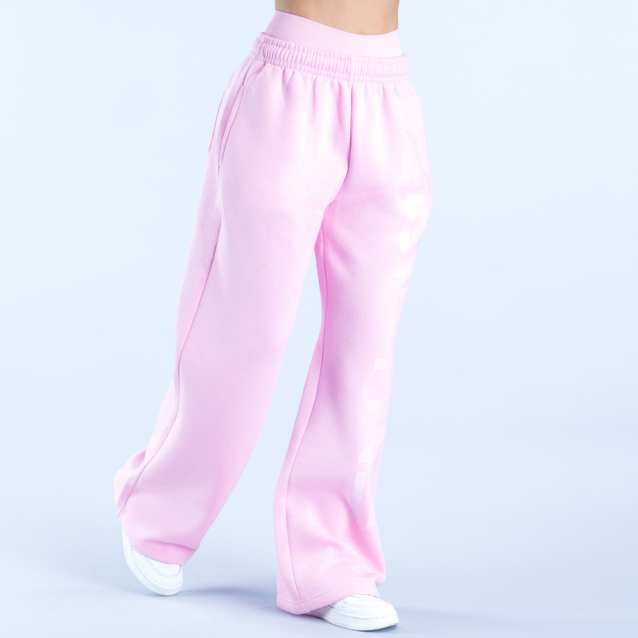 Pink wide-leg jogger pants with gathered elastic waist and loose straight legs