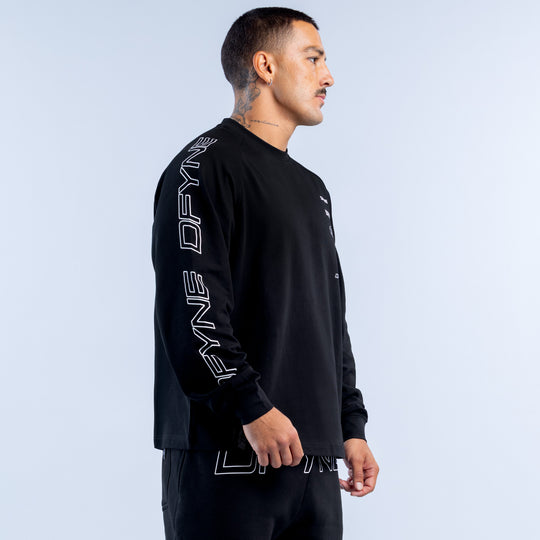 Black long-sleeve crewneck top with vertical white DFYNE text on sleeve