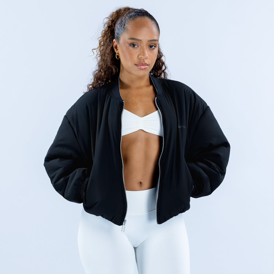 Black bomber jacket with zip front and ribbed collar, front view