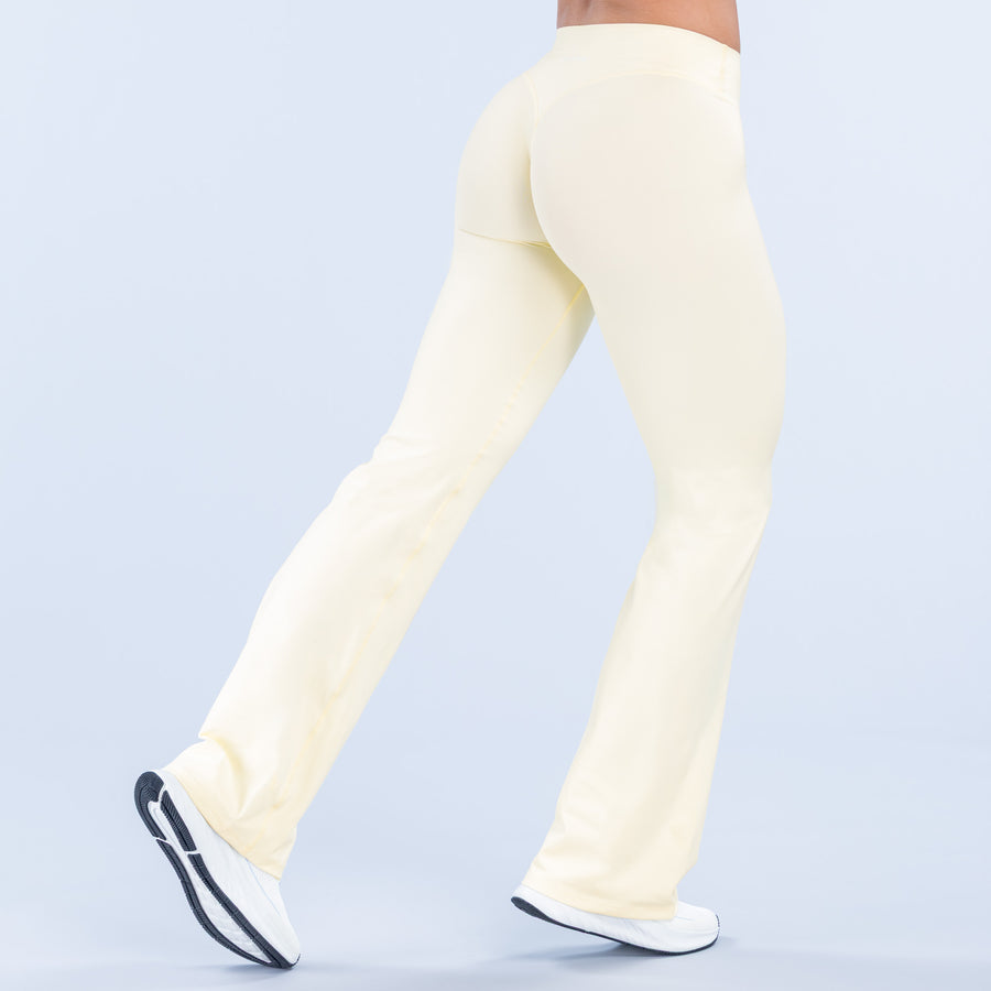 Light yellow flared pants, back view with wide leg and clean waistband