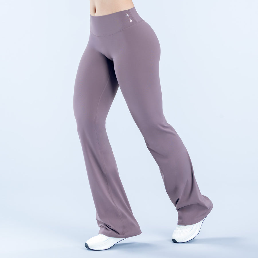 High-waist mauve flared leggings, full-length with wide ankle flare.