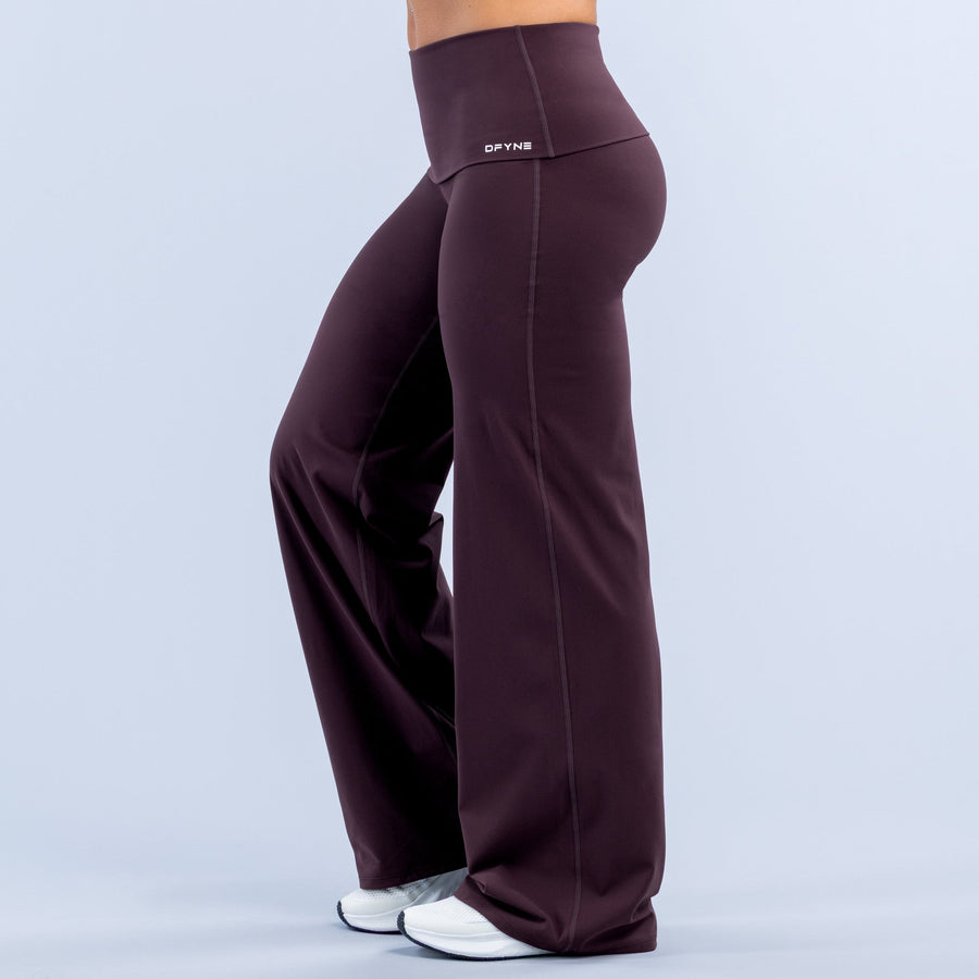 Purple fold-over wide-leg workout pants with high-rise waistband and visible side seams