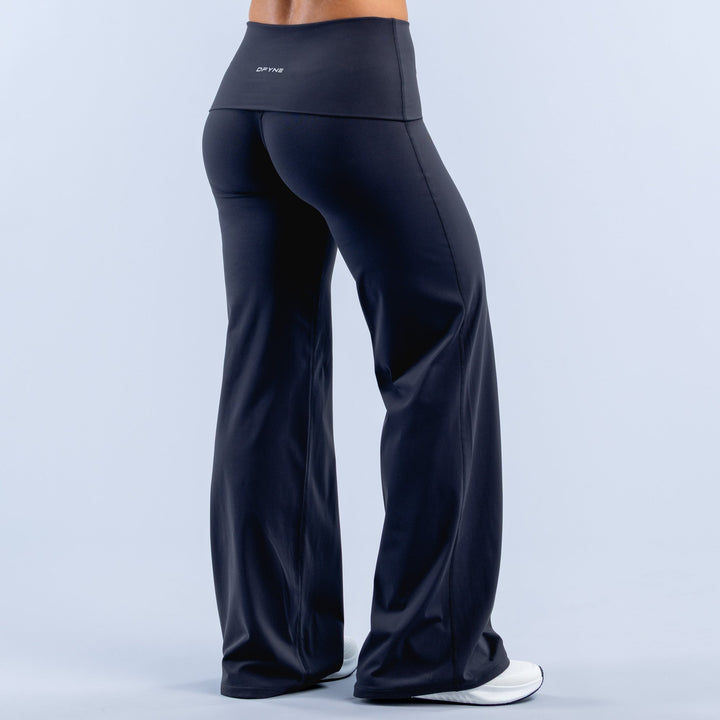 Dark navy wide-leg pants with fold-over waistband, side view, smooth drape