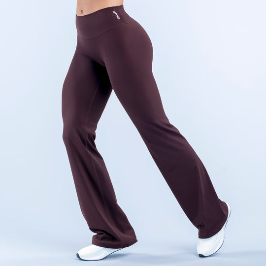 Burgundy high-rise flare leggings with small logo at waistband and wide bell legs