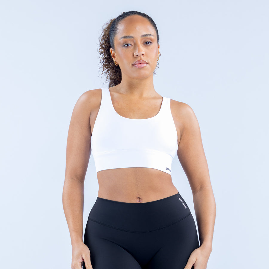 White racerback sports bra with wide, smooth underband