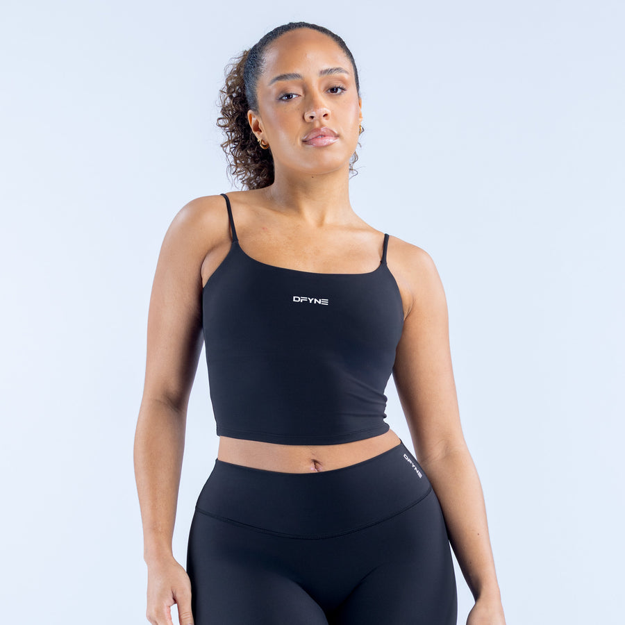 Strappy top with thin straps, scoop neckline, dark fabric, fitted cropped length