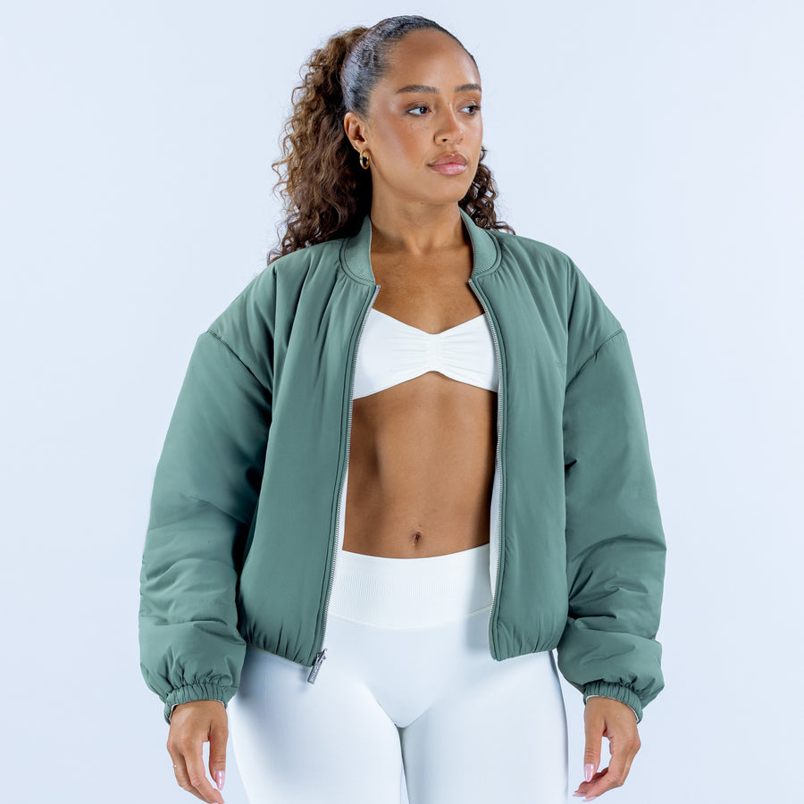 Reversible bomber jacket, dark green front with full zipper and ribbed trim.