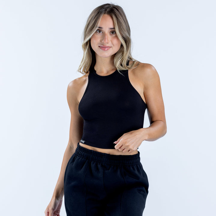 Ribbed sleeveless vest in dark navy with high neckline, fitted cropped cut