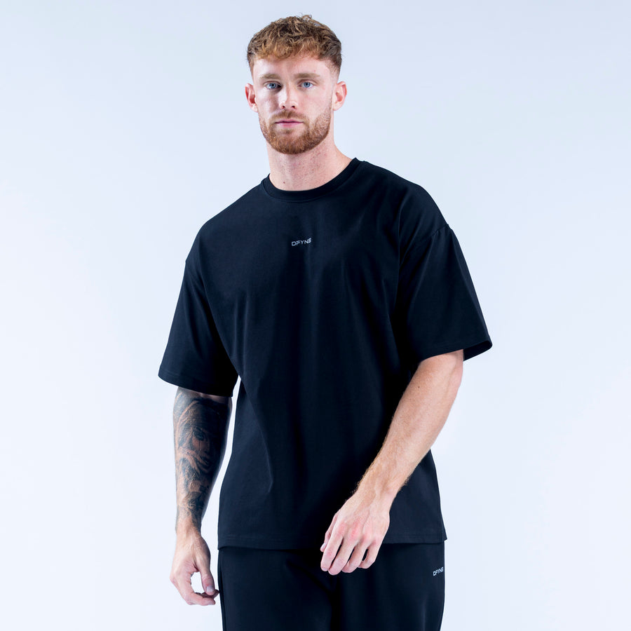 Recharge graphic t-shirt, dark crewneck with short sleeves and small chest logo.
