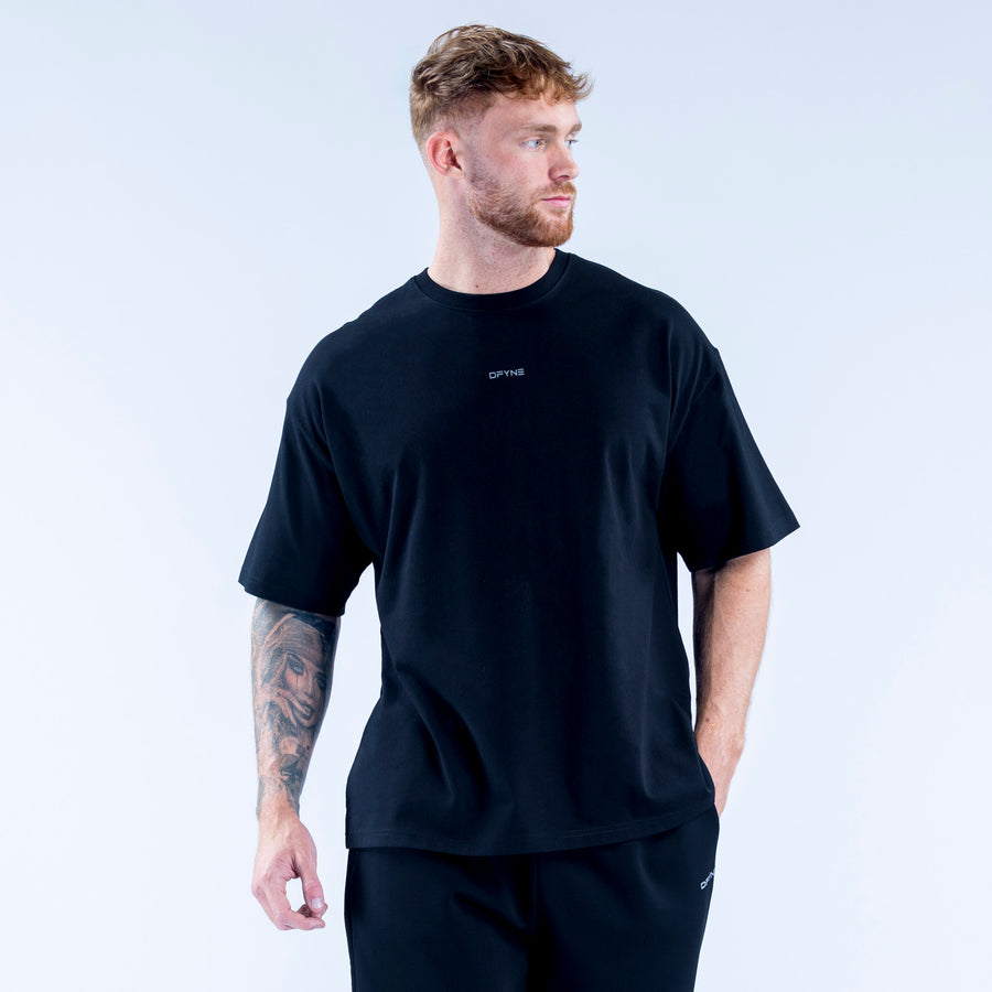 Recharge graphic t-shirt, dark crewneck with small chest graphic.