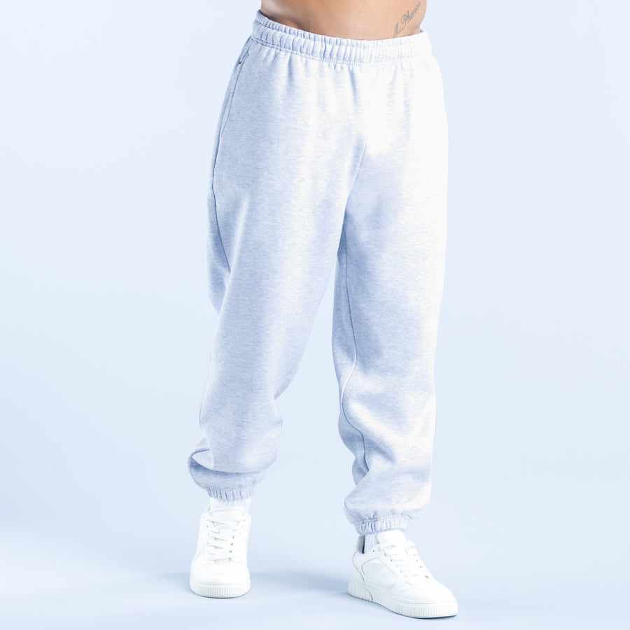 Light blue joggers with elastic waistband, tapered legs, and ribbed ankle cuffs