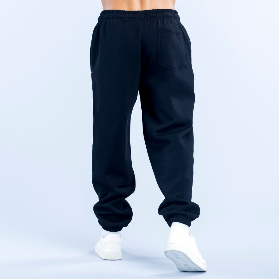 Recharge joggers in dark fabric with rear pocket detail and ribbed ankle cuffs