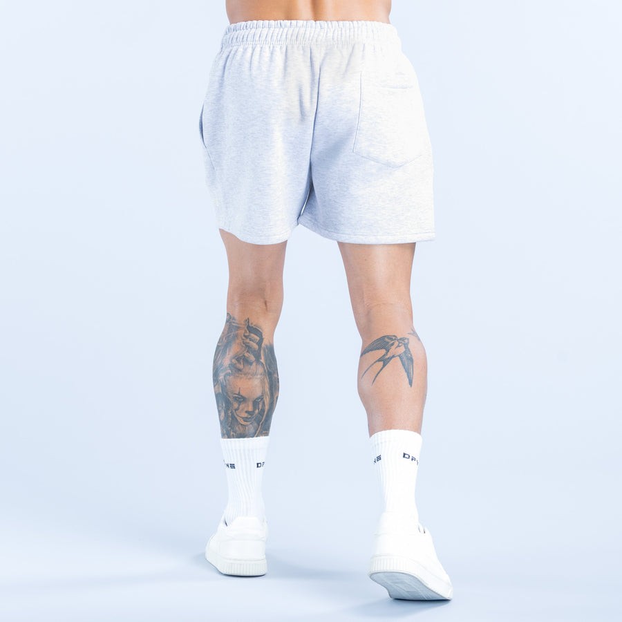 Light blue sweat shorts, back view with elastic waistband and straight hem