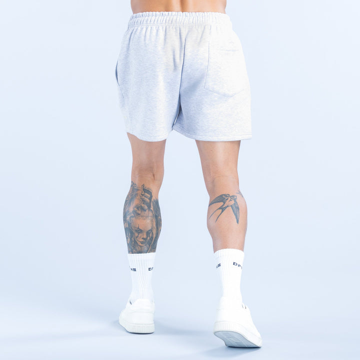 Light heather blue shorts with elastic waistband, above-knee cut, back view