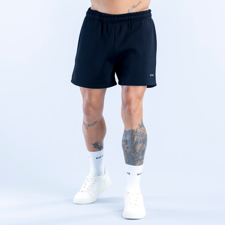 Dark navy drawstring athletic shorts with elastic waistband and small side logo