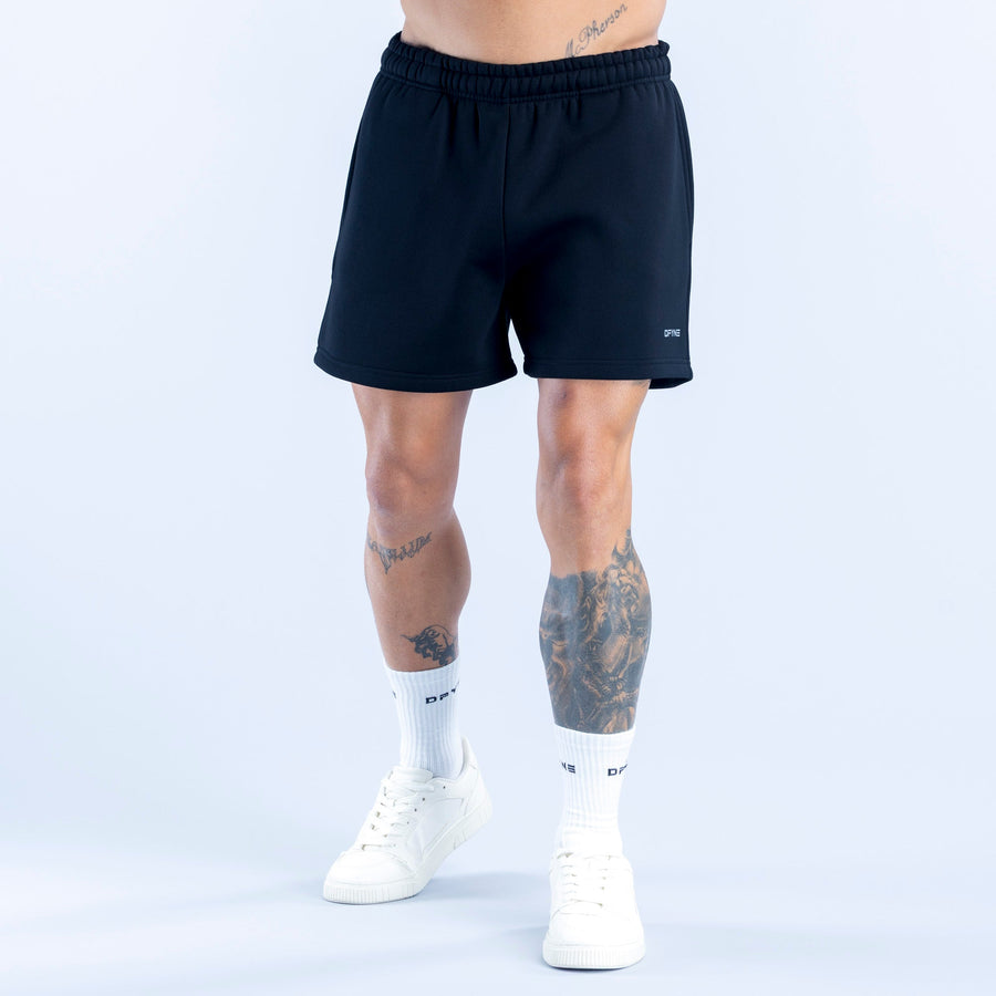 Dark athletic shorts with elastic waistband and small right-leg logo detail.