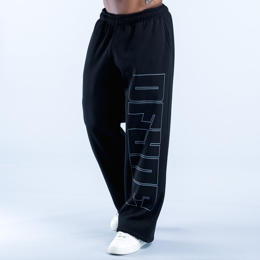 Black straight-leg joggers with large geometric side print and elastic waistband