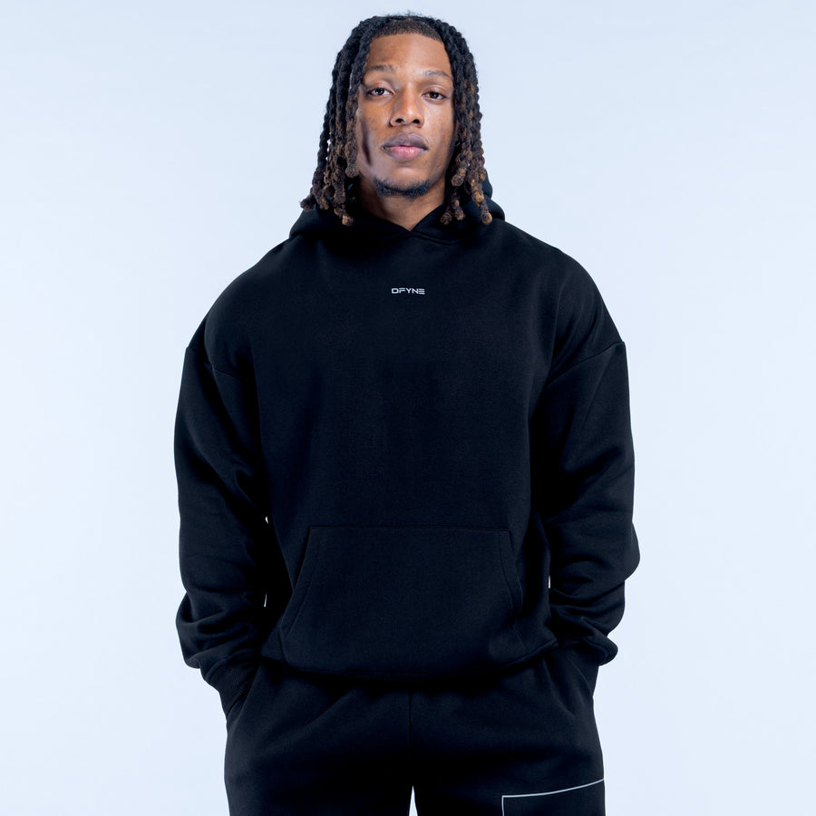 Black Recharge hoodie, front view with hood, kangaroo pocket, and small chest logo.