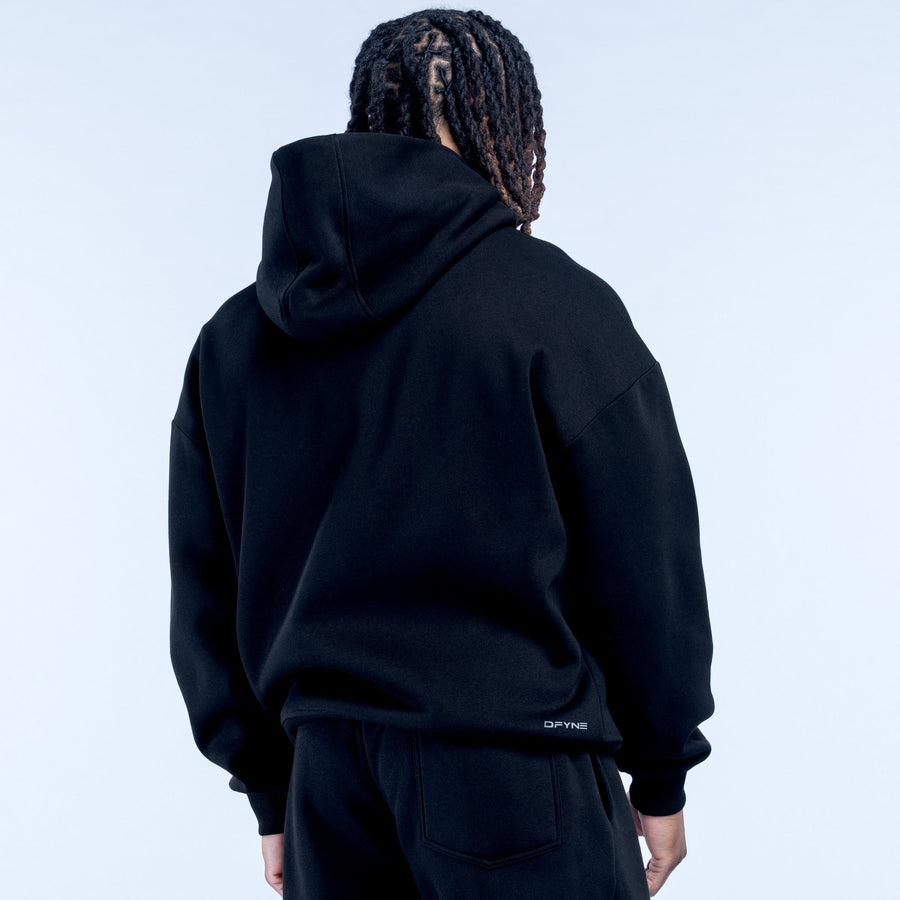 Black hoodie back view with hood and small hem logo, long sleeves
