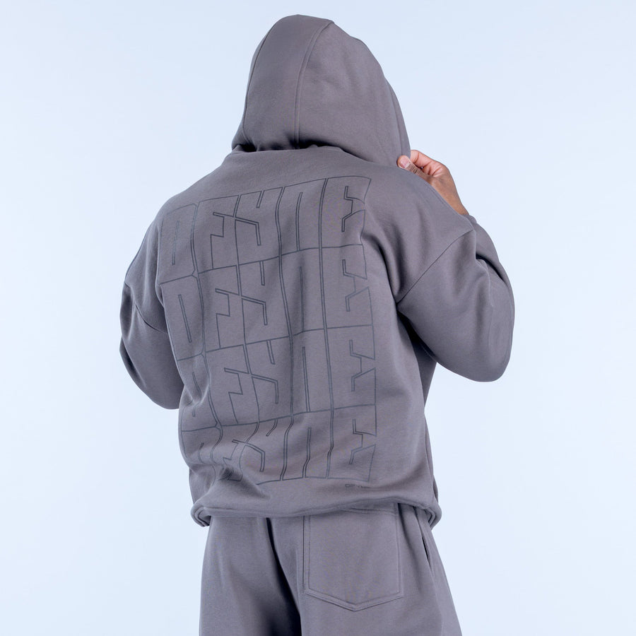 Dark gray hoodie with large geometric logo graphic on back and kangaroo pocket