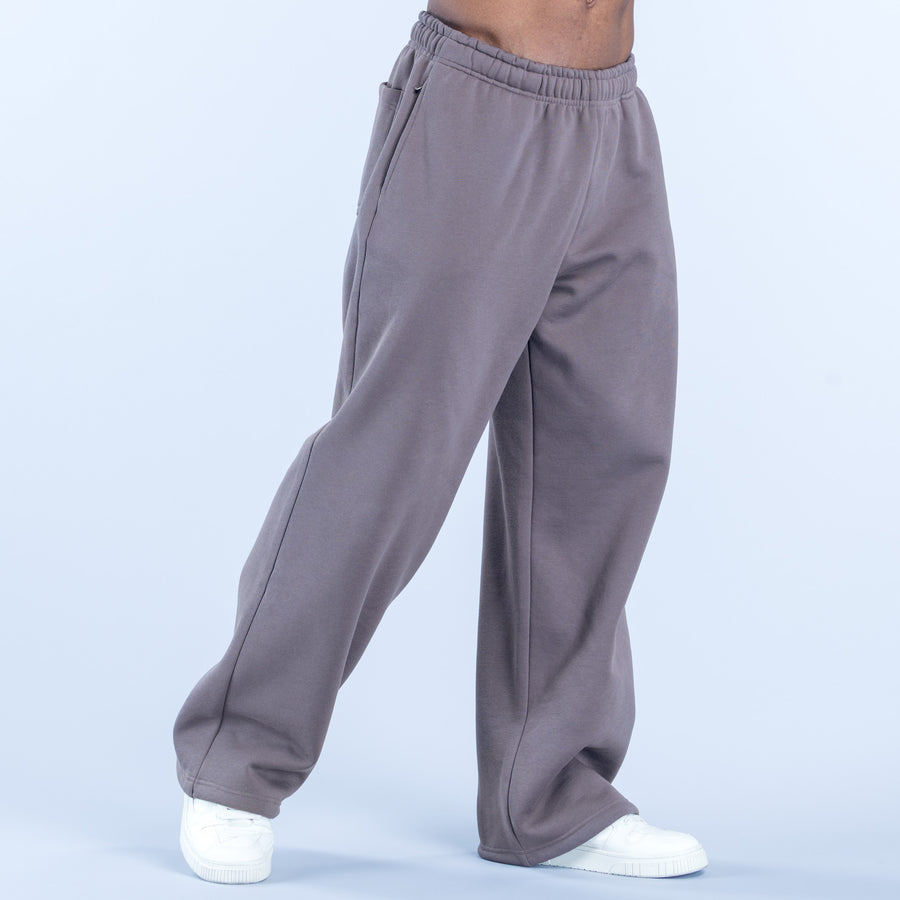 Dark gray straight-leg joggers with elastic waist and visible side seam stitching