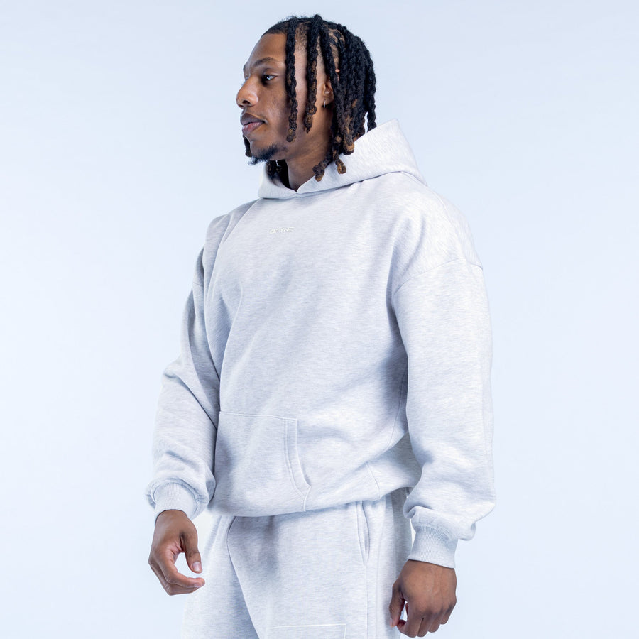 Light gray pullover hoodie with drawstring hood, kangaroo pocket, side view.