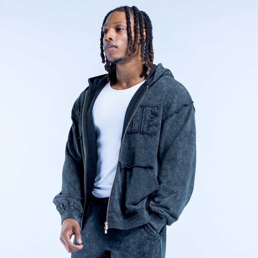 Dark gray washed zip hoodie with hood, flap pockets, and chest logo lettering