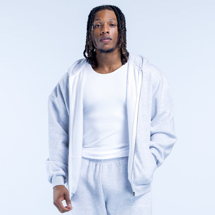 Light blue zip hoodie with hood, front zip open, long sleeves and kangaroo pocket