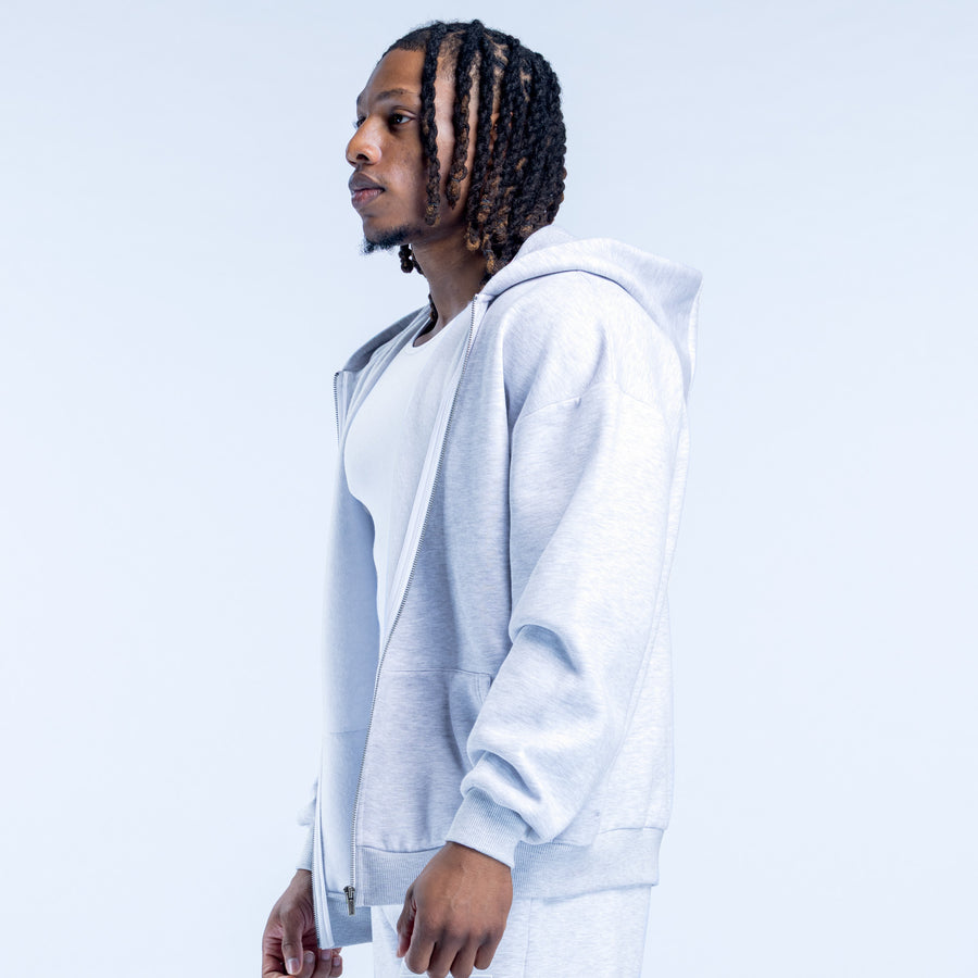 Light blue full-zip hoodie in side profile, hood and long sleeves with pocket