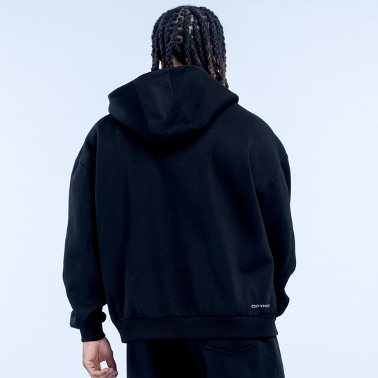 Black zip-up hoodie, rear view with hood, small logo at lower right hem