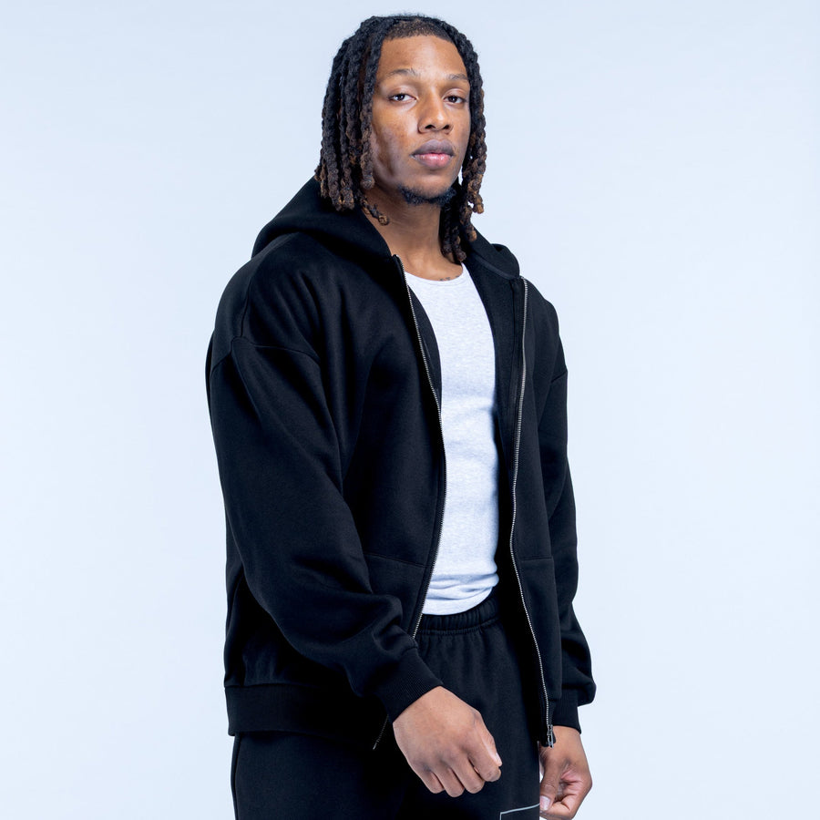 Black zip-up hoodie with hood, open front zipper, relaxed fit, ribbed cuffs