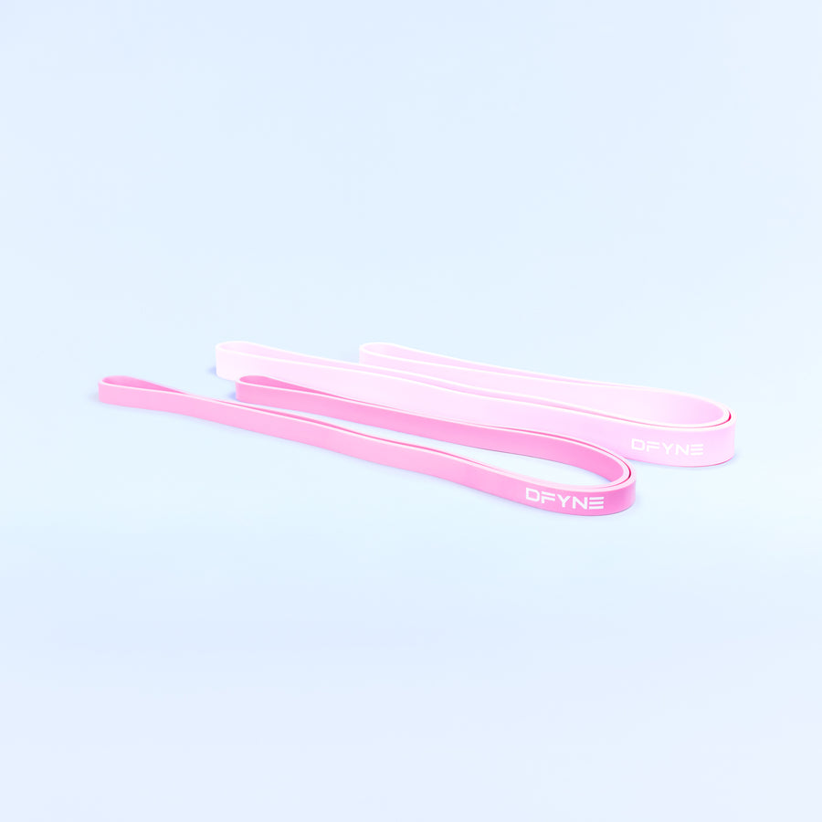Pink loop resistance bands, two long bands laid flat side by side