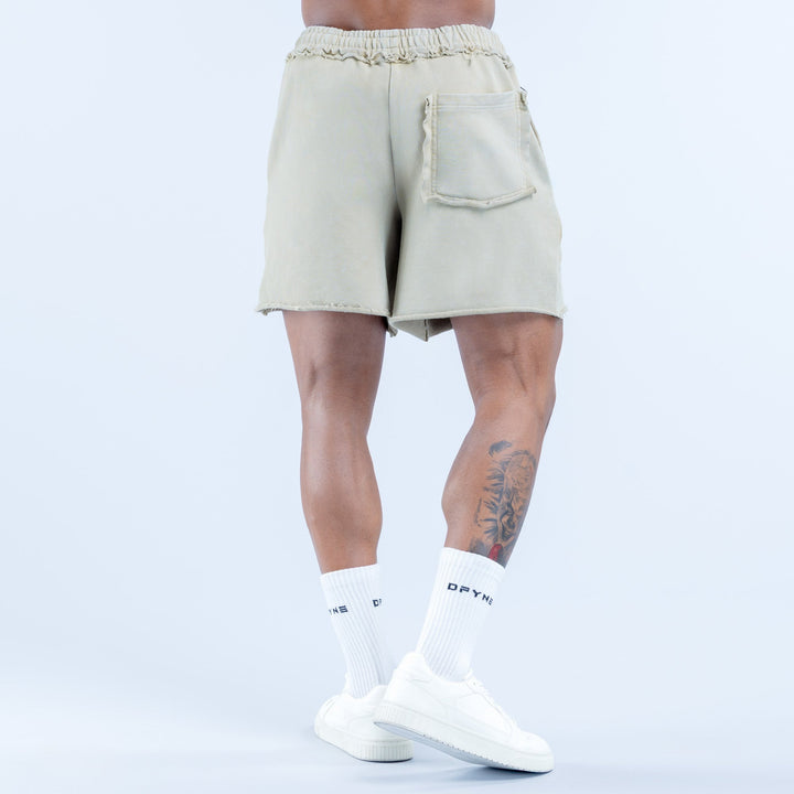 Light sage washed shorts, back view with elastic waistband and patch pocket